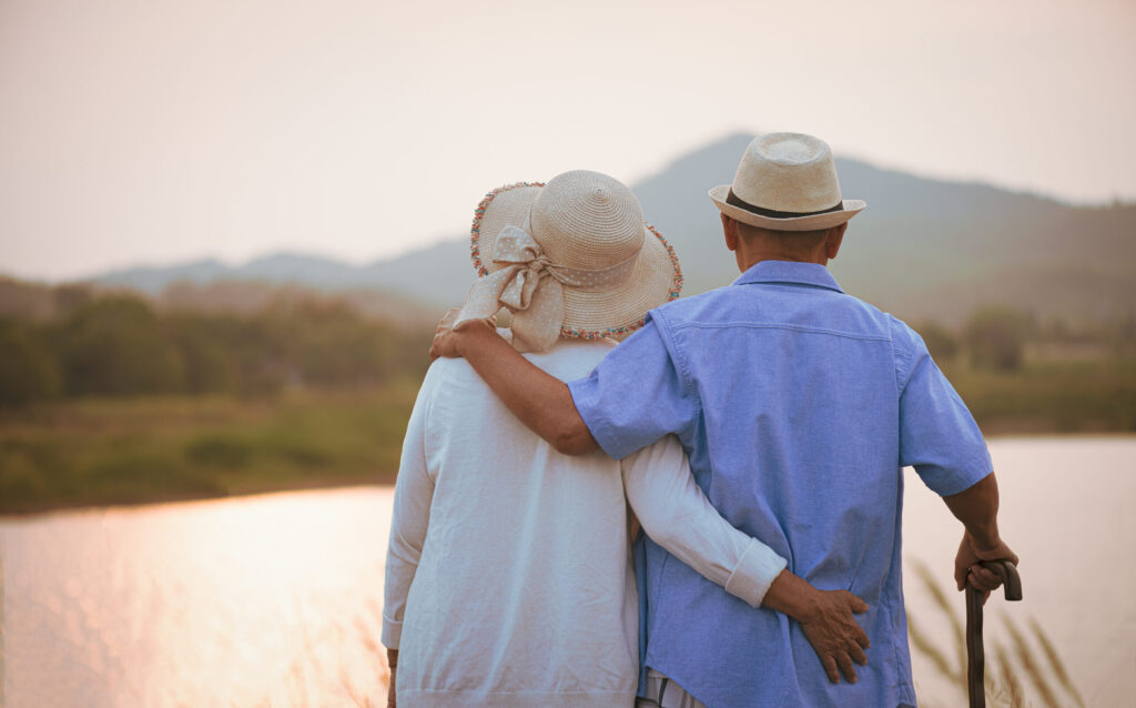 happy senior couple at sunset
